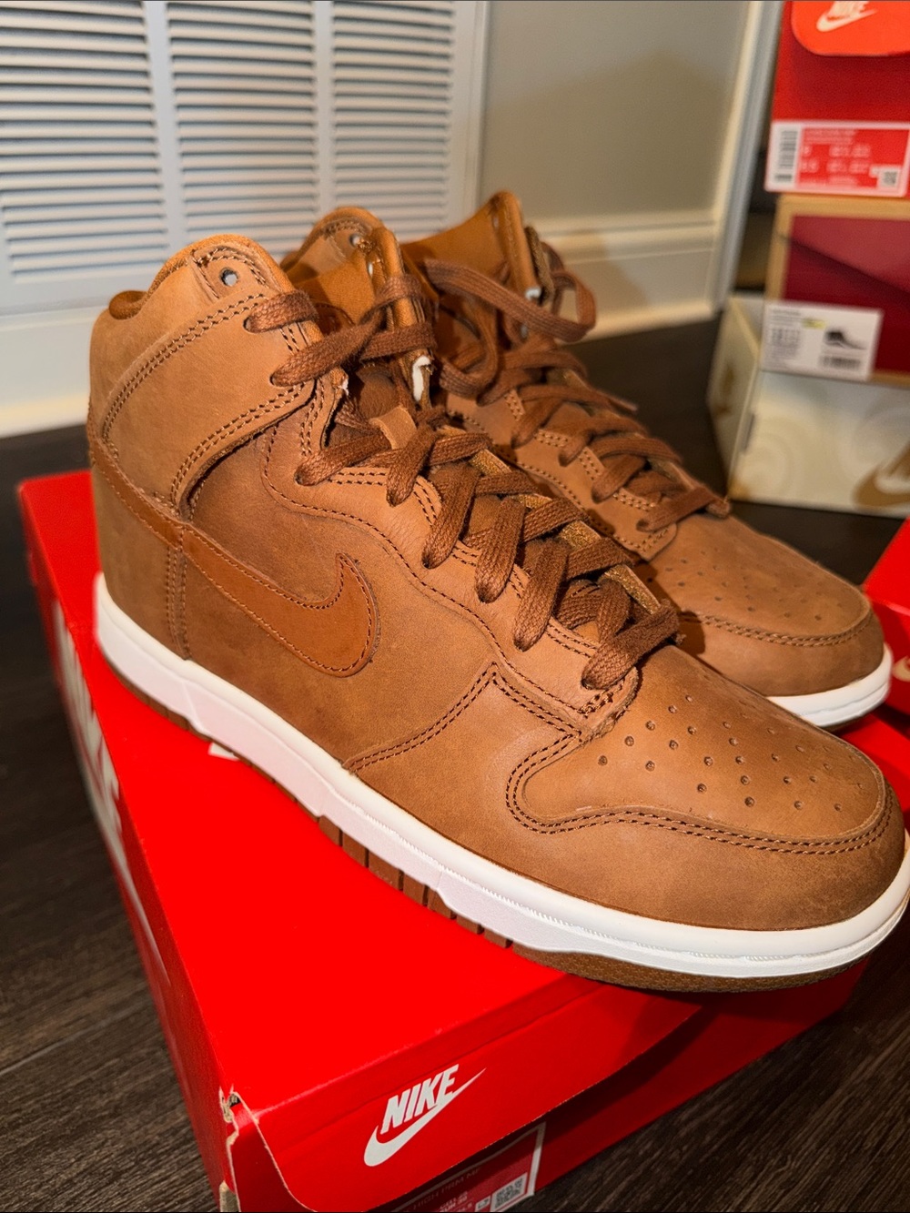 Nike women’s pecanTan/Brown High-Top Sneakers